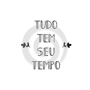 Everything has it`s time in Portuguese. Ink illustration with hand-drawn lettering. Tudo tem seu tempo photo