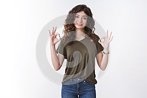 Everything okay not worry. Portrait confident friendly cheerful young caucasian curly-haired woman smiling assuring you