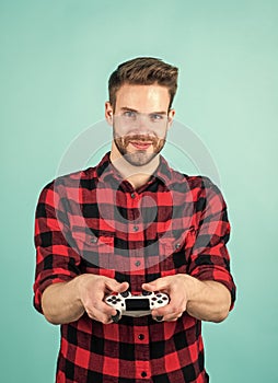 Everything is so real. young man hold game controller to play video games. relax at home. man play video games. console