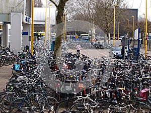 Everywhere parked bicycles before train station Gouda