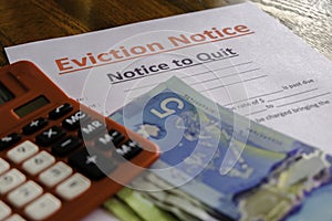 Eviction notice with Cash Canadian Dollars to pay outstanding and calculator