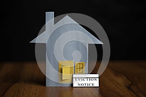 Eviction notice sticker infront of door - concept showing of tenant foreclosure or rent pending on black background.