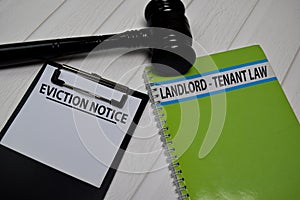 Eviction Notice text on Document form and book Landlord-Tenant Law isolated on office desk