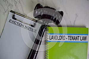 Eviction Notice text on Document form and book Lanlord-Tenant Law isolated on office desk