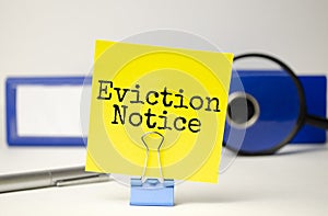 Eviction notice on the yellow sticker and blue folder