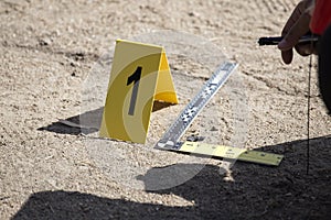 Evidence marker and ruler scale of evidence with law enforcemen