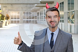 Evil businessman giving a thumbs up