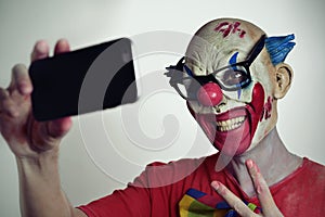 Evil clown taking a selfie