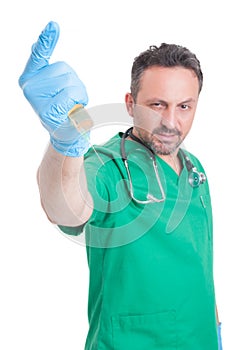 Evil doctor ready to stab with syringe