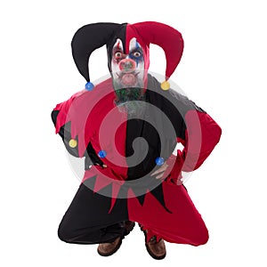 Evil jester sticking out the tounge, isolated on white