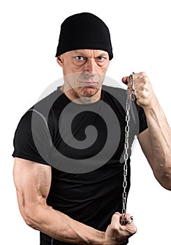 Evil man in black with chain tight in his hands