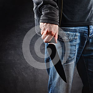 Evil man hold shiny knife, killer in action