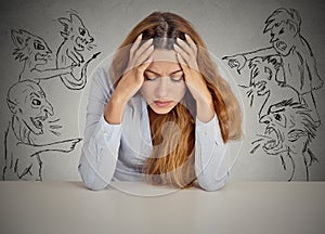 Evil Men pointing at stressed woman