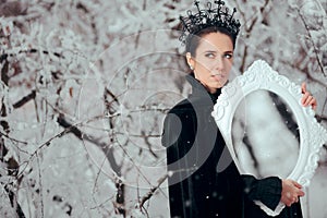 Evil Queen with Magic Mirror in Winter Wonderland