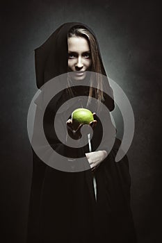 Evil queen offering a poisonous apple