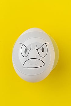 the evil scary angry face emotion painted on the easter egg, halloween concept