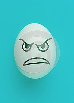 the evil scary angry face emotion painted on the easter egg, halloween concept