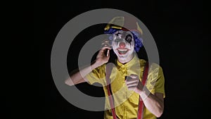 Evil scary clown dials the phone number to scare you.