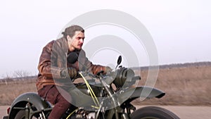 An evil sight of emotional man on vintage motorcycle in pursuit