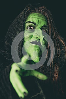 Evil witch casting a curse photo