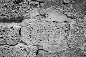 Texture of a wall of old tuff bricks