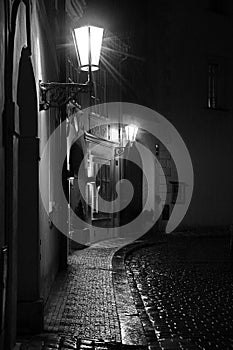 Evocative desert alley of Prague taken in a rainy night