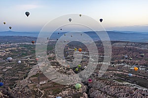 Evocative glimpse of Cappadocia with hot air balloons in flight