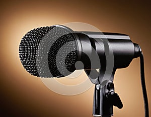 Vintage Microphone Illuminated by a Warm Spotlight on Stage