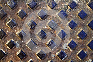 Texture of metal plate with embossed rhomboid patterns photo