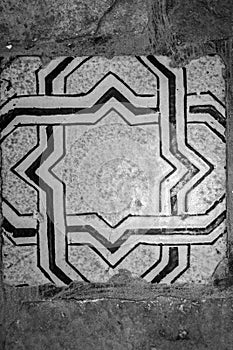 Old floor tile in black and white photo