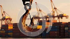 Industrial Sunset: Rusty Hook and Cargo Cranes