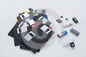 The evolution of digital data storage device. Floppy disks, flash drives and memory cards isolated on white background