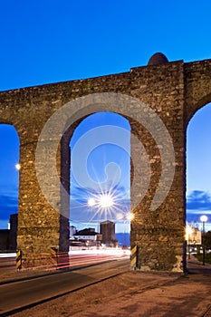 Evora aqueduct by night photo