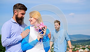 Ex partner watching girl starts happy love relations. Couple in love dating outdoor sunny day, sky background. Leave