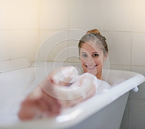 This is exactly what I needed. Portrait of a beautiful young woman relaxing in the bathtub.