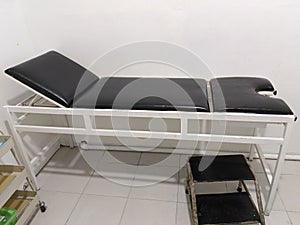 Examination bed for patient with stel ladder