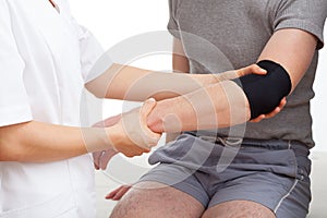 Examination of elbow photo