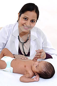 Examination of the newborn by doctor woman