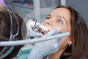 Examination oral cavity or treatment teeth, visiting dental office, blurred background