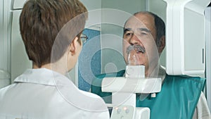 Examination of the patient by using panoramic and cephalometric X-Ray scanner photo