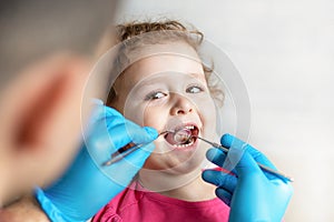 Examination, treatment teeth children. medical checkup oral cavity with instruments.