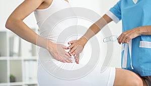 Examination by woman gynecologist, doctor touch belly, clinic appointment