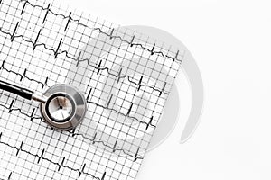 Examine the heart to prevent heart disease. Stethoscope and cardiogram on white background top view copyspace