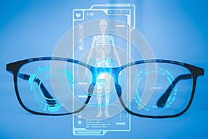 Examines a technological digital holographic plate representing the patient`s body, the heart lungs, muscles, and bones. Concept: