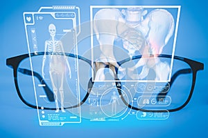 Examines a technological digital holographic plate representing the patient`s body, the heart lungs, muscles, and bones. Concept: