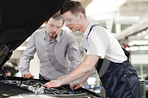 Examining a car.