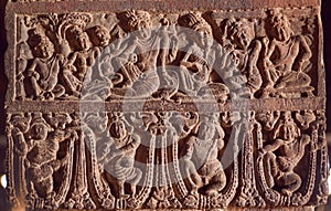 Example of Indian art carvings with life of ancient people and gods at 7th century temples in Pattadakal, India.