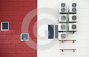 An example of installing a plurality of air conditioners on an external two-color wall of an industrial building. Air conditioners