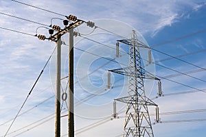 Examples of two overhead electricity pylons. UK