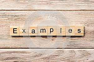 Examples word written on wood block. examples text on table, concept photo